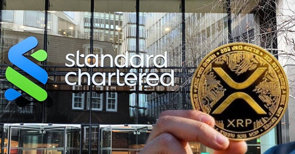 A XRP coin in front of Standard Chartered offices